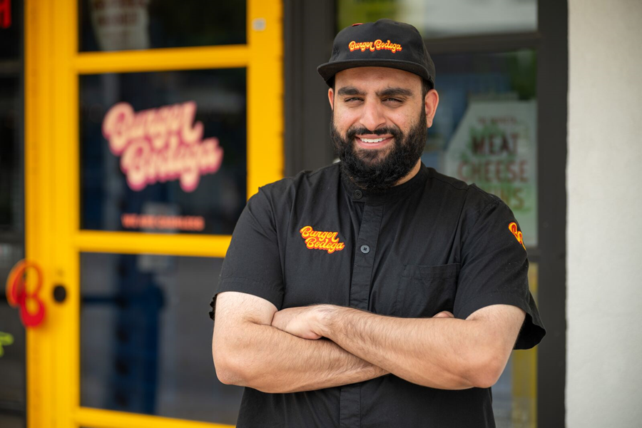 Abbas Dhanani, founder of Burger Bodega, standing outside the Houston restaurant.
