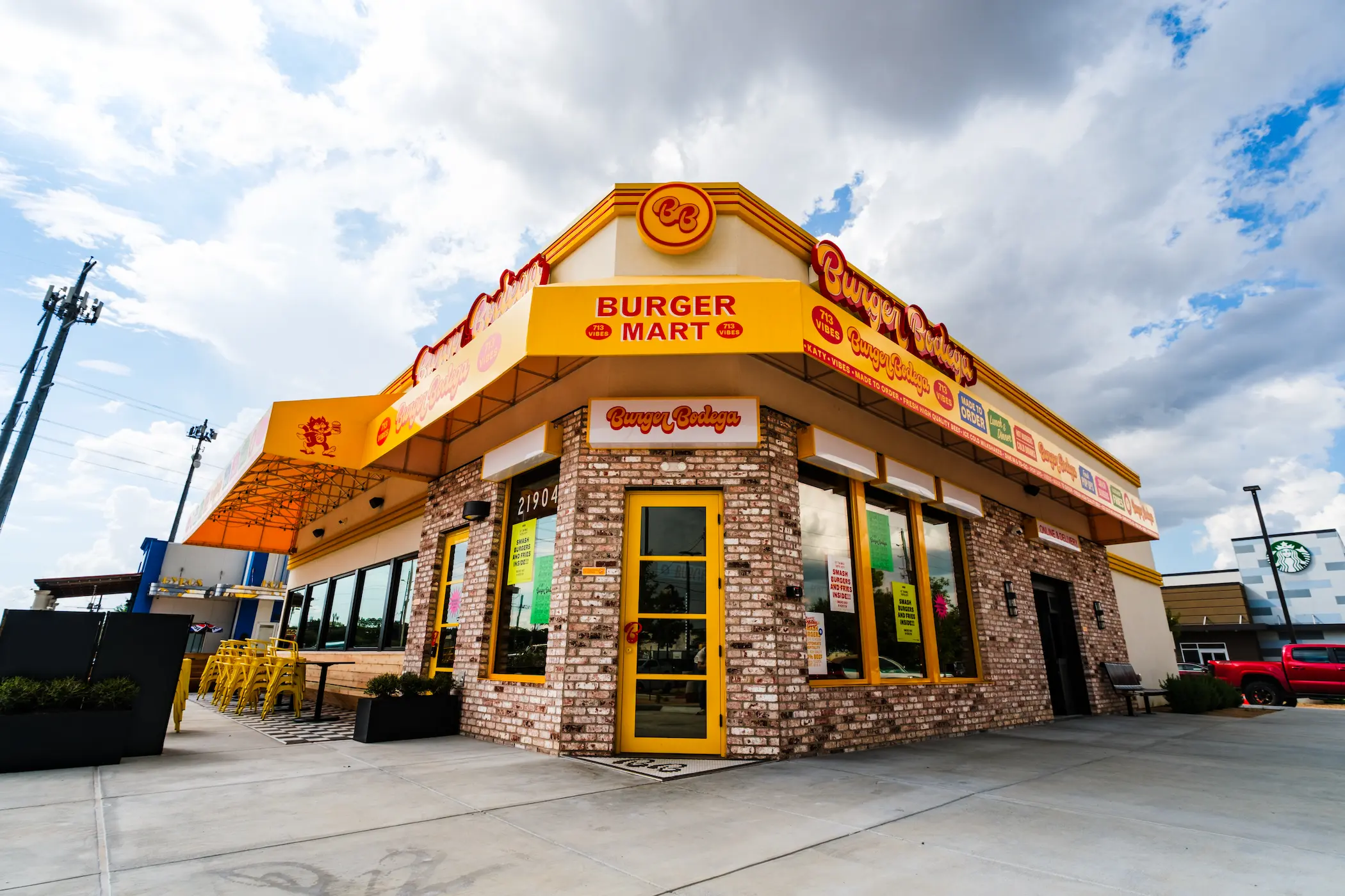 Burger Bodega Katy restaurant exterior at 21904 Franz Road, with its Burger Mart signage and outdoor seating area.